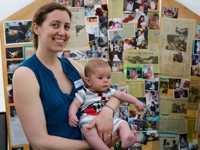 Lindsay MacDougall holds Nicolas Hills (born March 1) at the Community Midwives of Kingston 20th anniversary barbecue. (Alex Pickering/For The Whig-Standard)