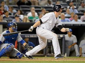 Yankees catcher Brian McCann hits a three-run triple against the Blue Jays during the 7th inning at Yankee Stadium in New York on Wednesday, June 18, 2014. (Robert Deutsch/USA TODAY Sports)