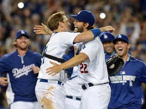 Los Angeles Dodgers starting pitcher Clayton Kershaw (22) with catcher A.J. Ellis (17) after recording the final out of his no hitter against the Colorado Rockies at Dodger Stadium on Jun 18, 2014 in Los Angeles, CA, USA. (Jayne Kamin-Oncea/USA TODAY Sports)