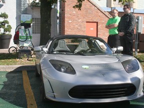 This Tesla Roadster, getting a charge at the new EV station at the Downtown Chatham Centre, is an all-electric vehicle known for its high performance.