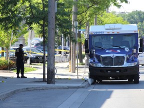A stretch of Avenue Road, north of Lawrence Avenue West, in Toronto is littered with empty shell casings after bandits opened fire on guards in a botched armoured car heist. (CHRIS DOUCETTE/Toronto Sun)