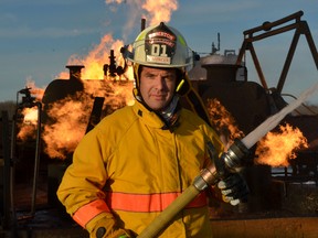 Rick Mercer poses during a shoot in 2001 at the Lambton College fire school for a past segment of The Rick Mercer Report, his long-running show on CBC. Mercer will be in Sarnia this month for three sold-out performances of his one-man stage show at the Imperial theatre.  (SUBMITTED PHOTO)