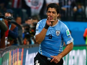 Uruguay's Luis Suarez celebrates after scoring his second goal against England during World Cup action at the Corinthians arena in Sao Paulo on Thursday, June 19, 2014. (Tony Gentile/Reuters)