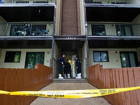 Forensics officers head in to an apartment, 12914-66 Street, after a man was found dead outside the building in Edmonton, Alberta early on Wednesday, May 23, 2012. The death is considered suspicious and is under investigation. AMBER BRACKEN/EDMONTON SUN/QMI AGENCY