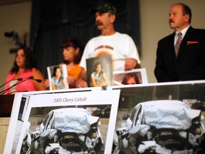 Family members of General Motors crash victims hold a news conference prior to testimony by GM CEO Mary Barra (not seen) before a House Energy and Commerce Oversight and Investigations Subcommittee hearing on the GM ignition switch recall on Capitol Hill in Washington June 18, 2014. REUTERS/Jonathan Ernst