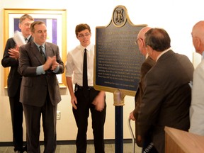 Intelligencer file photo
City officials, Dr. James B. Collip Recognition Committee, volunteers and guests gathered for the unveiling of the plaque commemorating the efforts and life of Dr. James Collip in 2014.