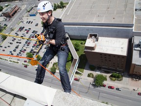 Chris Montanini descends in the 26 storey tower at the City Centre London, Ontario on Thursday, June 19, 2014. He was taking part in an event to promote Rope For Hope, a fundraiser for Make-A-Wish Foundation on Friday. DEREK RUTTAN/ The London Free Press /QMI AGENCY