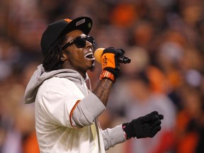 Rapper Lil Wayne sings "Take Me Out To The Ball Game" during the seventh inning stretch in Game 6  of the MLB NLCS playoff baseball series between the St. Louis Cardinals and the San Francisco Giants in San Francisco.

REUTERS/Robert Galbraith/Files