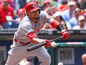 Cincinnati Reds centre fielder Billy Hamilton (6) bunts for a single in the first inning against the Philadelphia Phillies at Citizens Bank Park on May 18, 2014. (BILL STREICHER/USA TODAY Sports)