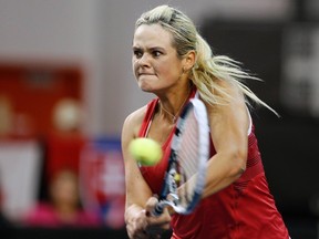 Canada's Aleksandra Wozniak plays a shot against Slovakia's Jana Cepelova during their Fed Cup tennis match at the PEPS stadium at Laval University in Quebec City, April 19, 2014. (REUTERS/Mathieu Belanger)