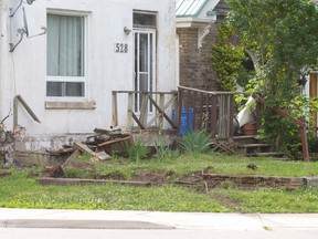 The front porch of a Quebec Street home is in splinters after a 16-year-old crashed a van into the front of the home in London shortly before 2 a.m. on Friday June 20, 2014.  Police have charged the youth with impaired driving and other offences who hit the house after attempting to make a sharp turn onto Princess Ave. and losing control.  CRAIG GLOVER/The London Free Press/QMI Agency