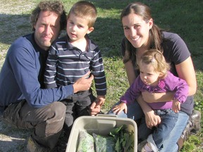 Joe and Eraina Grootenboer, with their children Hugo and Lydia, in a file photo from September 2013. Their business, River Bell Market Garden, has seen its boxed vegetable program take off this year.