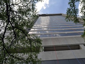 A participant taking part in an event promoting Rope For Hope, a fundraiser for Make-A-Wish Foundation Southwestern Ontario, descends a 26-storey tower at City Centre London Thursday June 19, 2014. CHRIS MONTANINI\LONDONER\QMI AGENCY