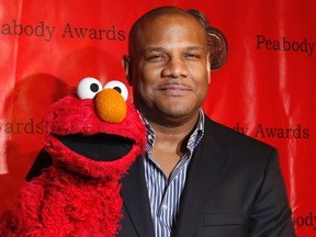 Voice actor Kevin Clash arrives with the puppet Elmo for the 2010 Peabody Award ceremony at the Waldorf Astoria in New York in this file photo taken May 17, 2010. (REUTERS/Lucas Jackson/Files)