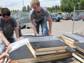 Construction students at Spruce Grove Composite High School packed a trailer full of doghouses they built for Humane Animal Rescue Team (hart), a not-for-profit organization that works to rescue and support abandoned and stray dogs in rural Alberta and the Edmonton-area. The group built 20 houses in total for large and medium sized dogs. - Karen Haynes Reporter/Examiner
