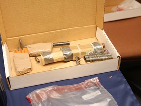 Greater Sudbury Police found ammunition, weapons and a homemade explosive device at a Spruce Street residence in Sudbury, ON. The items were on display during a press conference at police headquarters on Friday, June 20, 2014. Brennan Boucher, 20, has been charged with a number of offences including making explosives. JOHN LAPPA/THE SUDBURY STAR/QMI AGENCY
