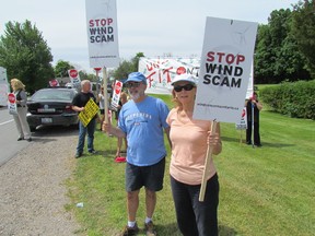 Hal March and Mary Lynch joined a group of wind turbine protesters outside the Oakwood Conference Centre in Grand Bend Friday where recent Ontario Environment Ministry Jim Bradley had been scheduled to speak. Bradley cancelled his appearance because of a scheduling issue, according to conference organizers. PAUL MORDEN/THE OBSERVER/QMI AGENCY