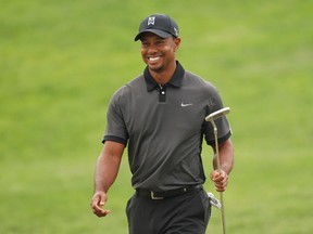 Tiger Woods will return to golf next week after back surgery in March sidelined him for three months. (Adam Hunger/Reuters)
