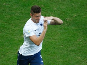 France's Olivier Giroud celebrates after scoring against Switzerland during their World Cup match at the Fonte Nova arena in Salvador, Brazil on Friday, June 20, 2014. (Fabrizio Bensch/Reuters)