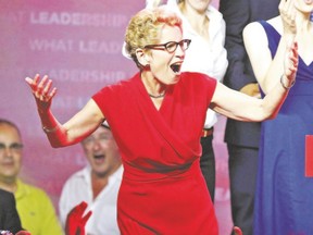 Liberal Leader Kathleen Wynne celebrates early returns in Toronto on election night, June 12. (Craig Robertson/QMI Agency)