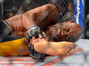 Anderson Silva reacts after breaking his leg on a kick to Chris Weidman during their UFC middleweight championship bout at the MGM Grand Garden Arena on Dec. 28, 2013. (Kamin-Oncea/USA TODAY Sports)
