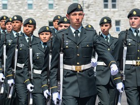 Cadets from the 2014 Aboriginal Leadership Opportunity Year march past the dais at the Royal Military College of Canada Parade Square on Friday. (Alex Pickering/For The Whig-Standard)