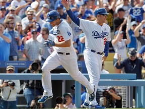 Los Angeles Dodgers third base coach Tim Wallach (right) will be inducted into the Canadian Baseball Hall of Fame in St. Marys, Ont., on Saturday. (Reuters)