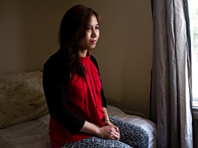 Junniflor Magno, a temporary foreign worker from the Philippines, poses for a photo at a west Edmonton home on Friday, June 20, 2014. (Codie McLachlan/Edmonton Sun)