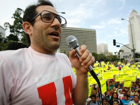 American Apparel owner Dov Charney speaks during a May Day rally protest march for immigrant rights, in downtown Los Angeles in this file photo taken May 1, 2009. Clothing and accessories retailer American Apparel Inc ousted its controversial founder Dov Charney as chairman effective immediately and moved to fire him as CEO and president following an ongoing investigation into alleged misconduct.  REUTERS/Mario Anzuoni/Files