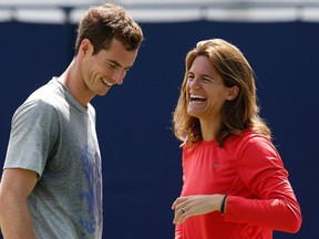 Britain's Andy Murray and coach Amelie Mauresmo react during a practice session at the Queen's Club Championships in west London June 12, 2014. (REUTERS/Suzanne Plunkett)