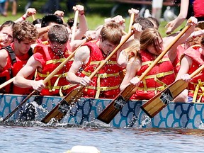 The  Funkadelic Franklin Flames, from the Ursula Franklin Academy  take part in the Dragon boat races at Centre Island on June 21, 2014. (Veronica Henri/Toronto Sun)