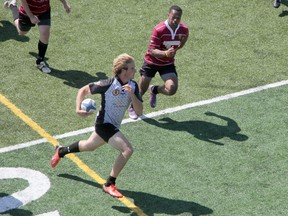 Isaac Butler of the Sarnia Saints Rugby Football Club (in grey) sprints for a try late in the 1st half of the men's A-side game versus the Brampton Beavers on Saturday, June 21. The Saints swept a triple header of games on their annual Play It Forward charity day, with Butler and his teammates winning 49-0. PHOTO COURTESY OF STU POWELL