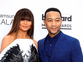 John Legend and model Chrissy Teigen arrive at the 2014 Billboard Music Awards in Las Vegas, Nevada May 18, 2014.    REUTERS/L.E. Baskow
