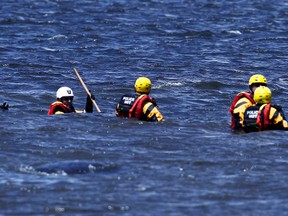 A water rescue unit from the Ottawa Police searches the Ottawa River near the Deschenes Rapids in the summer of 2012. This month alone six people have fallen into the river at Deschenes Rapids with one presumed drowned. Emergency officials continue to warn people to stay away from the fast water.
(QMI AGENCY/DARREN BROWN)