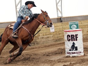 BELLEVILLE (06/22/2014)Maurice Miller of Wellington, riding Dollars in Demand, round the second barrel during their run in the Cedar Rail Farms barrel show Sunday. The farm hosted the two-day show with more than 100 participants of all ages. The event was sanctioned National Barrel Horse Association and Ontario Barrel Horse Association. This was the first show of the kind in this area. 
Emily Mountney/The Intelligencer/QMI Agency