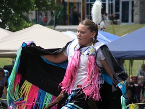 Six Nations dancer Julia Burning, 12, competes in the fancy shawl category at the 53rd annual Aamjiwnaang Powwow Sunday. About 3,000 spectators turned out to take in traditional dancing, drumming and authentic First Nations crafts during the two-day event. BARBARA SIMPSON/THE OBSERVER/QMI AGENCY