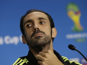 Spain's player Juanfran attends a news conference at the Arena Baixada soccer stadium in Curitiba, June 22, 2014. (REUTERS/Henry Romero)