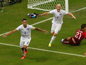 Clint Dempsey (L) of the U.S. and Michael Bradley celebrate after Dempsey scored his team's second goal during their 2014 World Cup Group G soccer match against Portugal at the Amazonia arena in Manaus June 22, 2014. (REUTERS/Andres Stapff)