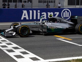 Mercedes Formula One driver Nico Rosberg of Germany celebrates as he crosses the finish line during the Austrian F1 Grand Prix at the Red Bull Ring circuit in Spielberg on Sunday. (DAVID W. CERNY/Reuters)