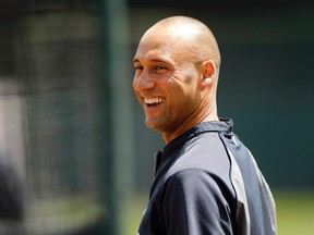 New York Yankees infielder Derek Jeter (2) stands outside the batting cage before the start of the game against the Oakland Athletics at O.co Coliseum on June 15, 2014. (CARY EDMONDSON/USA TODAY Sports)