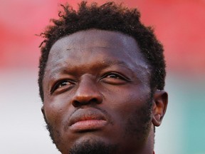 Ghana's Sulley Muntari listens to his country's national anthem before their international soccer friendly against South Korea at Sun Life stadium ahead of the 2014 World Cup in Miami, in this June 9, 2014 file photo. (REUTERS/Wolfgang Rattay/Files)