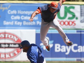 Maicer Izturis of the Toronto Blue Jays slides into second on a double play, with Carlos Correa of the the Houston Astros in Dunedin Florida on Thursday March 13, 2014. (Veronica Henri/QMI Agency)
