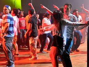 This picture taken on June 15, 2014 shows people enjoying a club event in Tokyo. (AFP PHOTO/Yoshikazu Tsuno)