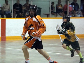 Lucas Knowles of the Sarnia Pacers Bantam B team sprints away from a Welland defender during their championship match of the Herb Lea Memorial Lacrosse Tournament on Sunday, June 22. Knowles and his teammates won the game and the tournament with a 3-2 victory. (SHAUN BISSON/THE OBSERVER/QMI AGENCY)