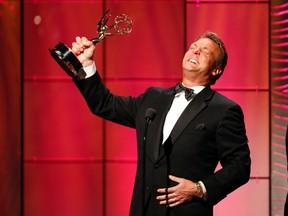 Doug Davidson accepts his outstanding lead actor in a drama series award for his role in "The Young and the Restless" during the 40th annual Daytime Emmy Awards in Beverly Hills, California June 16, 2013. REUTERS/Danny Moloshok