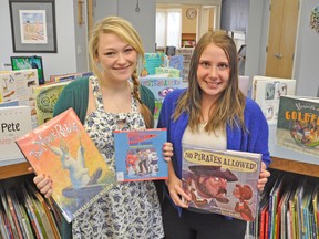 The TD Summer Reading Program takes place from July 2-Aug. 22 at the West Perth Public Library in Mitchell. Encouraging kids to read this summer are program leaders, Kara Woodcock (left), and Jessica Richardson-Tweddle. Focusing on the theme "Eureka!", children will participate in reading, games, and various activities in the program. KRISTINE JEAN/MITCHELL ADVOCATE