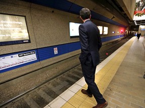 FILE: Edmonton Mayor Don Iveson looks down the tracks for an LRT train at Churchill Station in Edmonton, Alta., on Tuesday, March 11, 2014. Perry Mah/ Edmonton Sun