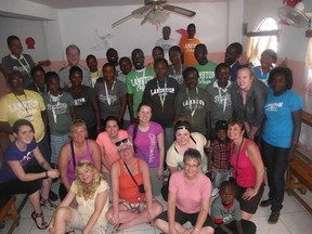 Haitians wearing Lambton College t-shirts stand with students from the college. Students recently participated in a nine day trip as part of a new course in international community development. BRENT BOLES / THE OBSERVER / QMI AGENCY