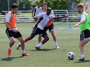 Ottawa Fury FC players, from left, Drew Beckie, Pierre-Rudolph Mayard, Mason Trafford and Richie Ryan train Monday at Algonquin College. 
(Chris Hofley/Ottawa Sun)