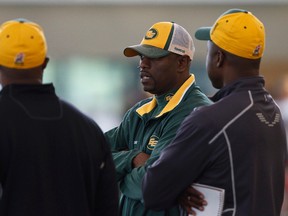Ed Hervey, shown here talking with staff during camp, says QB Mike Reilly combines the fiery competitiveness of Jason Maas with the quiet efficiency of Ricky Ray. (Ian Kucerak, Edmonton Sun)